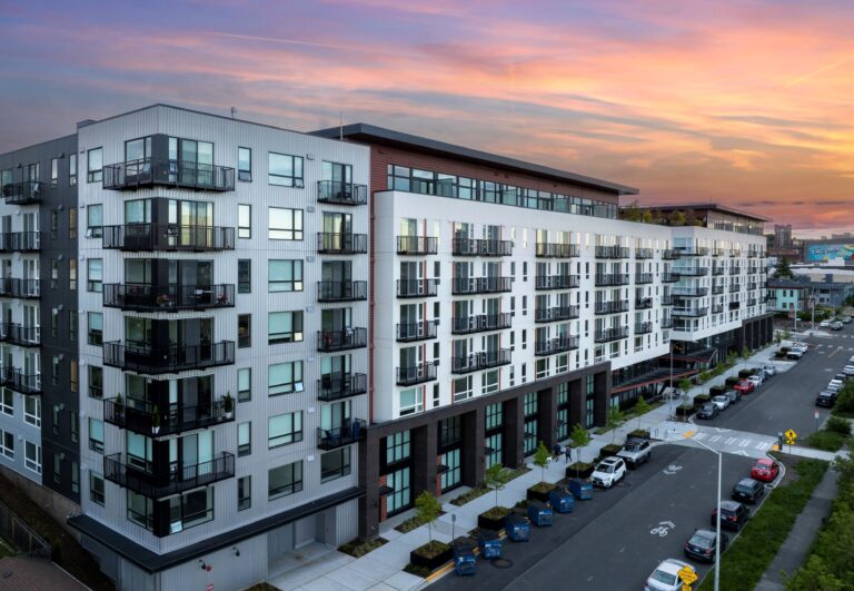 Exterior photo of Rook apartments in Tacoma at sunset.